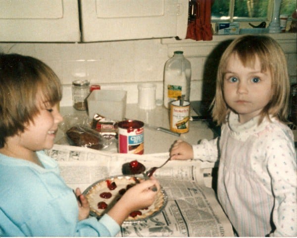 My sister Kelsey (left) and me (right) in our grandmother’s kitchen making a cherry pie.