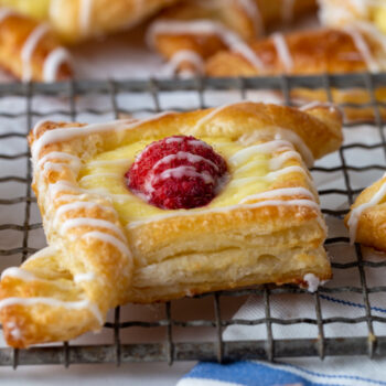 Cream Cheese Breakfast Danish topped with a raspberry