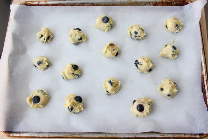 Blueberry cookie dough on baking sheets before being baked. 