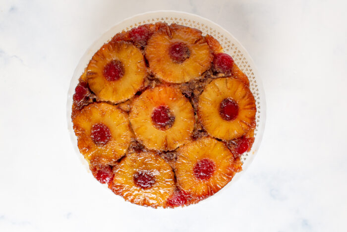 Pineapple Upside Down Cake with Pecans on a cake plate