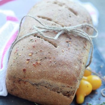 Spicy Garlic and Herb Bread loaf tied up with string