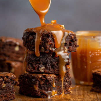 stack of brownies with caramel sauce drizzled on top