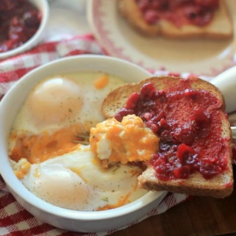 A Breakfast Egg Bake in a dish and cranberry sauce on toast