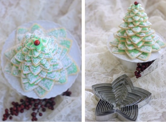 Sour cream sugar cookies cut out in varying sizes of stars and stacked to form a christmas tree shape