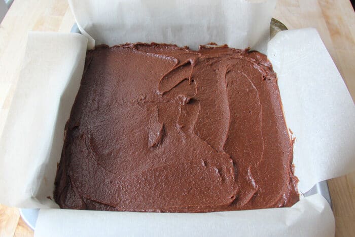 Brownie batter spread in the pan for the brookies