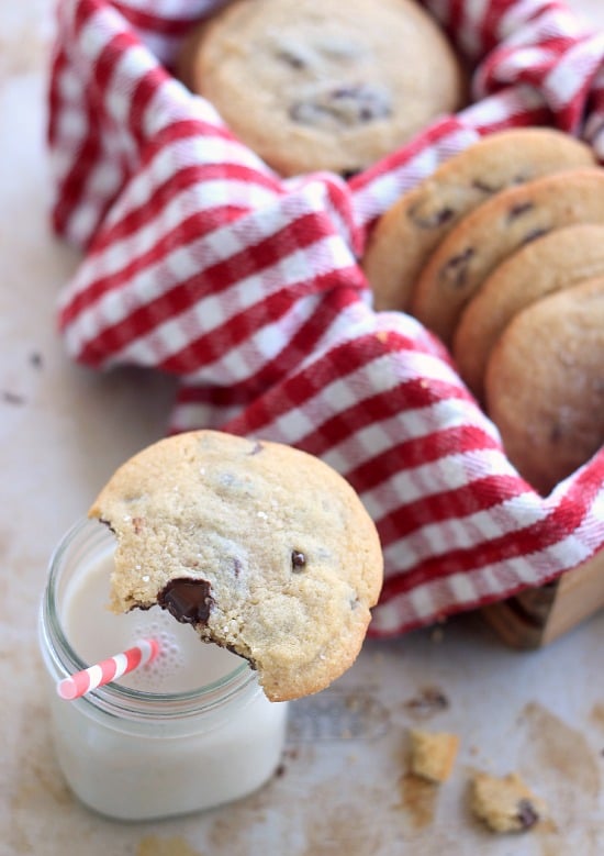 Chocolate Chip Cookies in a basket with a glass of milk
