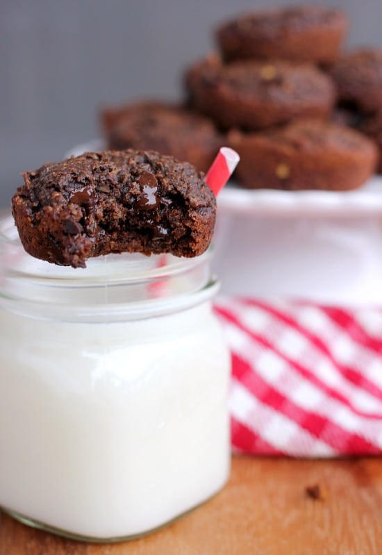 Chocolate Peanut Butter Oatmeal Brownie Bite perched on a glass of milk