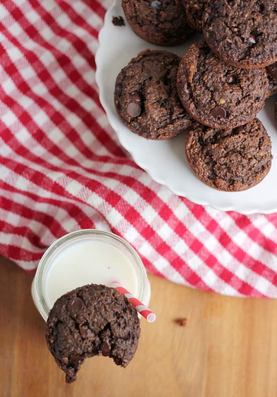 Chocolate Peanut Butter Oatmeal Brownie Bite perched on a glass of milk