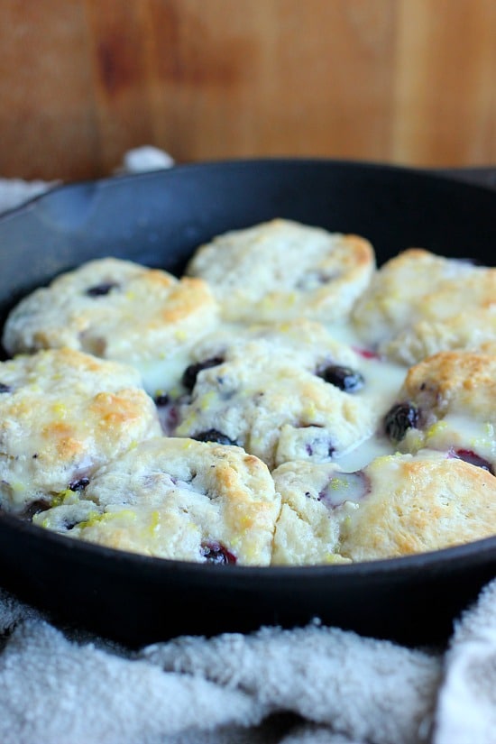 Blueberry Biscuits with Lemon Glaze in a skillet