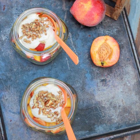 Peaches and Cream in a mason jars topped with pecans