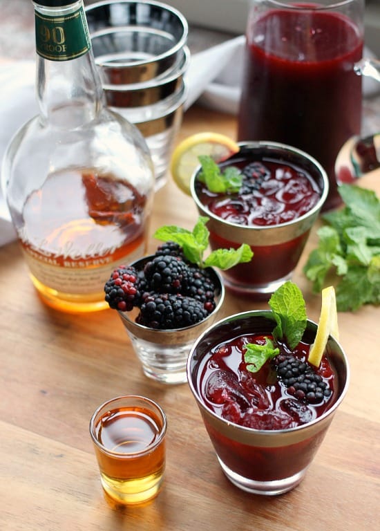 Bourbon Blackberry Mint Lemonade in glasses garnished with whole blackberries and mint leaves