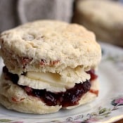 Buttermilk Bacon biscuit topped with butter and blackberry jam