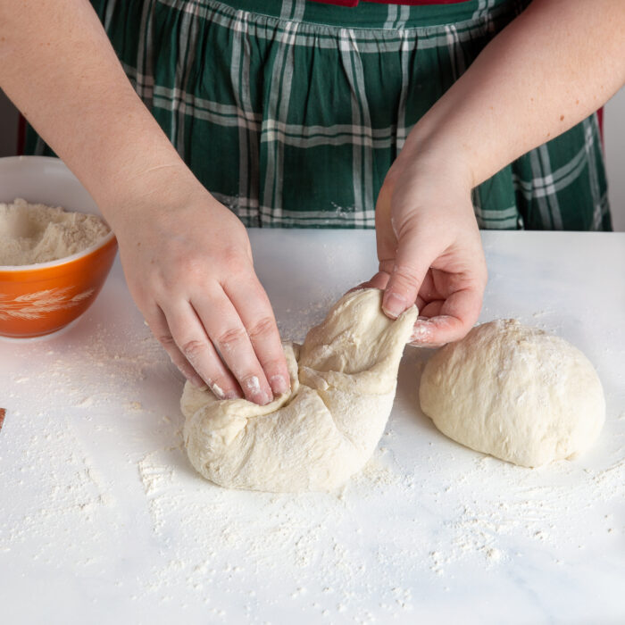 Dough being shaped into a ball