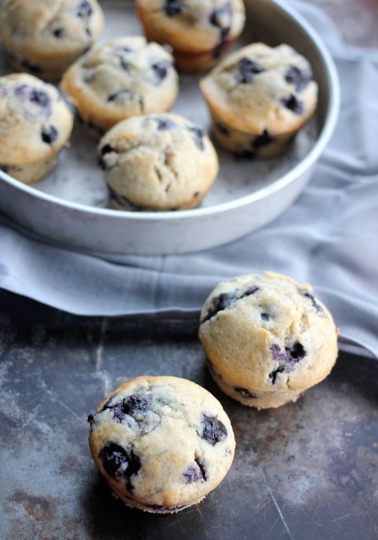 Blueberry muffins on the counter and in a pan