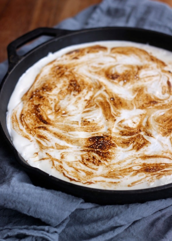 S'mores Brownie Pie in a skillet with toasted marshmallow cream on top