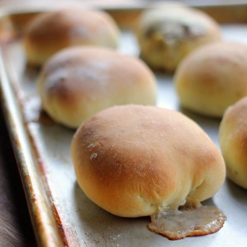 Rolls stuffed with Philly cheesesteak filling