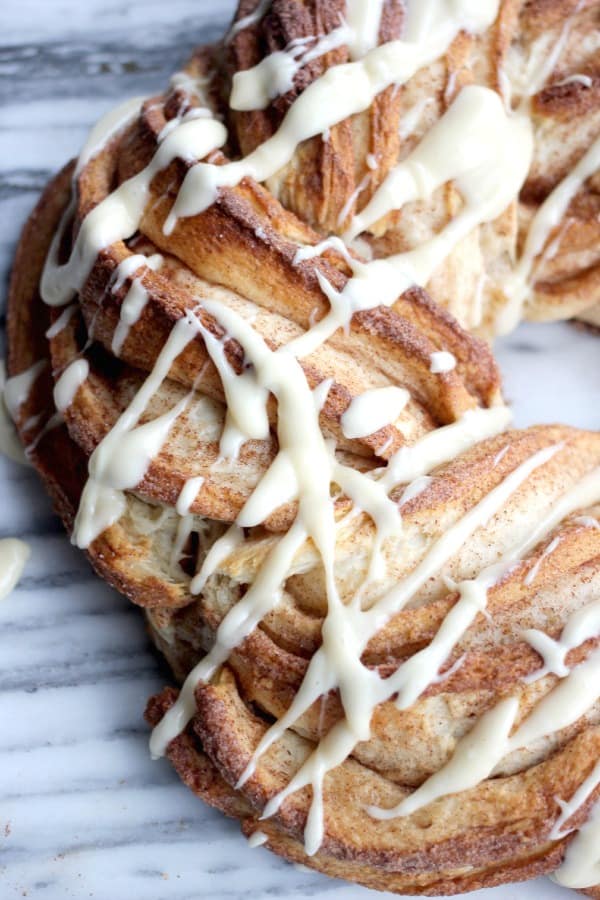 Cinnamon Roll Wreath drizzled with cream cheese frosting