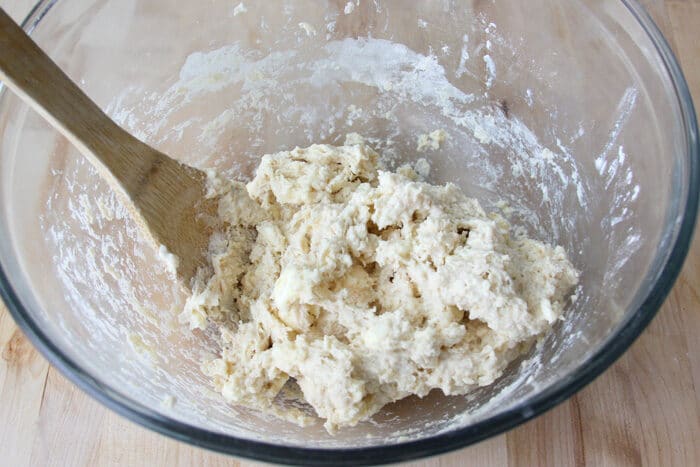 Drop biscuit dough in the bowl before being scooped