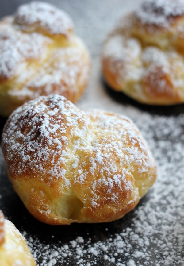 Cream puffs topped with powdered sugar
