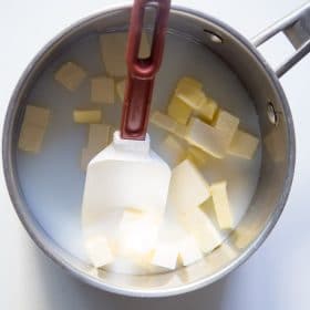 Water, milk and butter in a pot