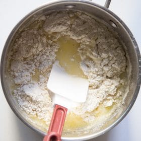Flour stirred into pot