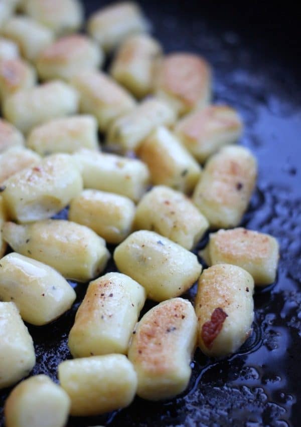 Pan frying the gnocchi until golden brown