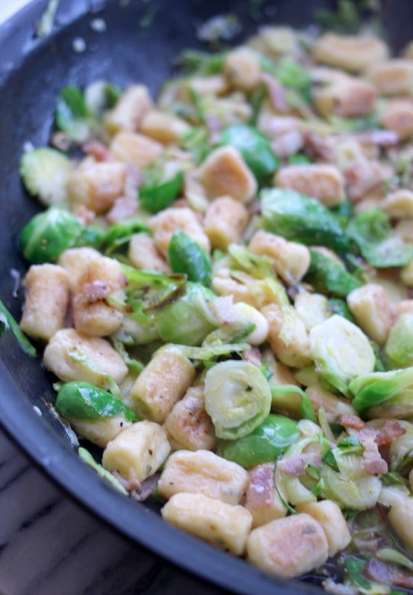 Parisienne Herb Gnocchi with Bacon and Brussels Sprouts in a pan