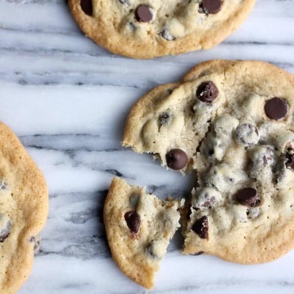 Thin and Crispy Chocolate Chip Cookies on a marble slab