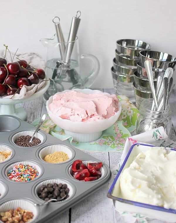 A make-you-own bar setup to top your frozen yogurt with fruits, chocolate, nuts, sprinkles, etc.