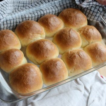 Soft Sour Cream Dinner Rolls in a glass baking dish