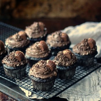 Peanut Butter Cup Stuffed Cupcakes on a wire rack