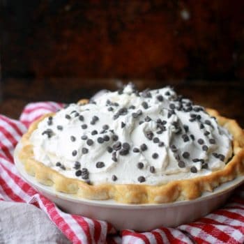 A Chocolate Cream Pie decorated with whipped cream and mini chocolate chips