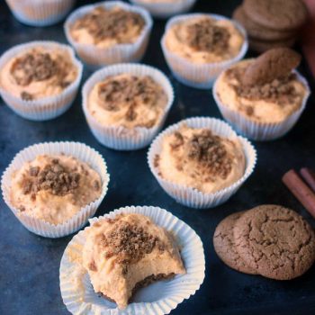 No-Bake Pumpkin Cheesecake filled into muffin liners topped with ginger snap cookie crumbs