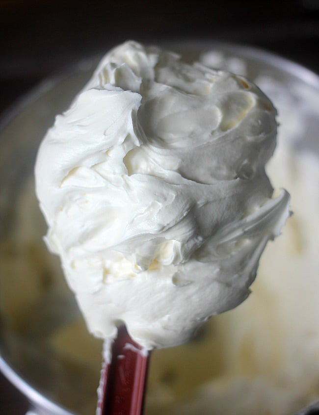 cream cheese frosting on the end of a spatula