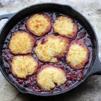 Triple Berry Cobbler in a cast iron skillet