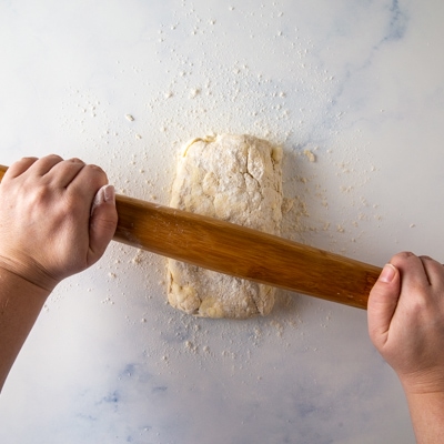 Rolling out rough puff pastry dough