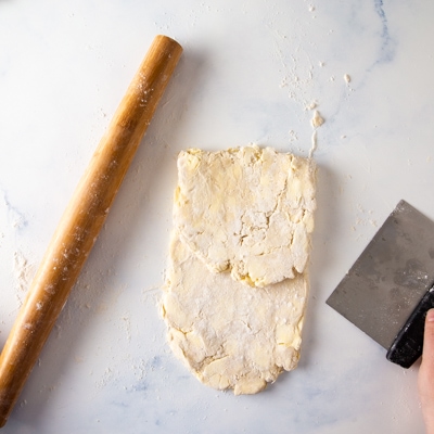 Folding a third of the dough over itself