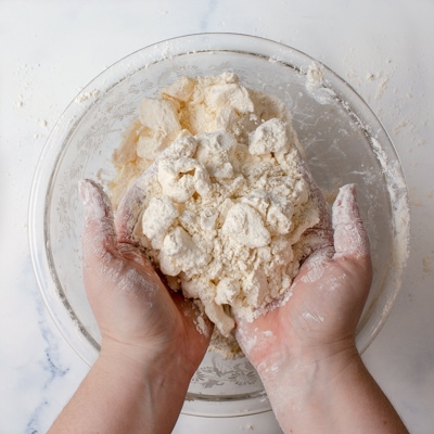 Showing the shaggy texture of the mixture after the butter has been worked in