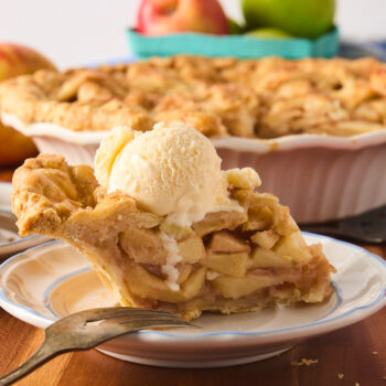 a slice of apple pie with vanilla ice cream on top