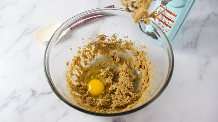 Adding eggs and anise extract to the peppernut dough