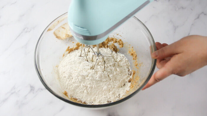 Mixing in the flour for the peppernuts