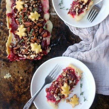 Brie Cranberry Tart topped with pecans and fresh thyme