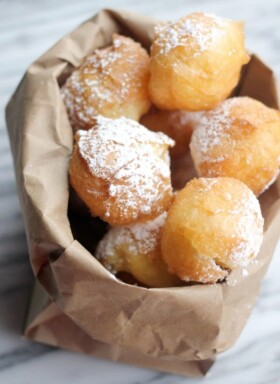 A bag full of fried beignets