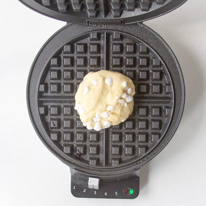 Dough ball placed on waffle iron