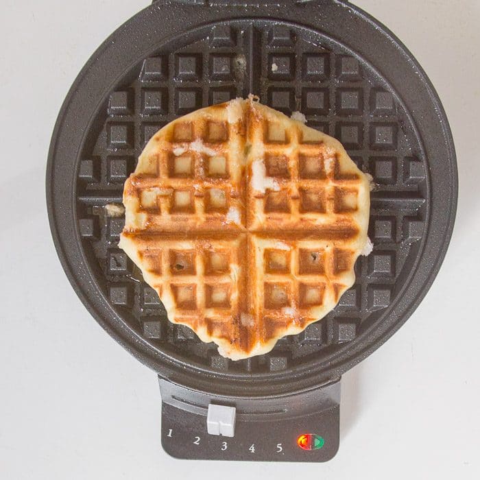 Cooked waffle in waffle iron