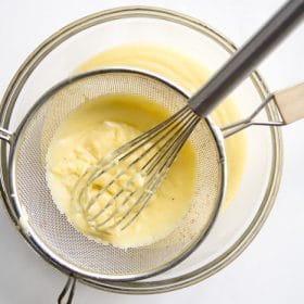 Pastry cream going through a strainer