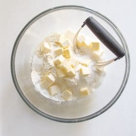 Butter being cut into the dry ingredients