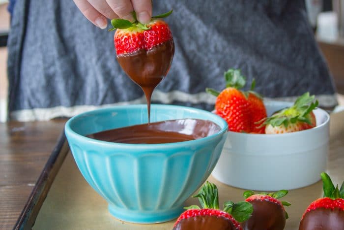 Fruit dipped into melted chocolate