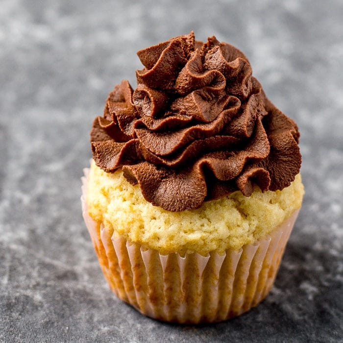 Whipped ganache topped over a cupcake