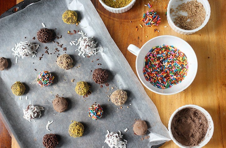 This is a recipe for French chocolate truffles, which is a very simple yet decadent dessert. This style of dessert truffles are made with only three ingredients: melted chocolate, cream, and cocoa powder. Learn the process of how to make chocolate truffles for an easy yet impressive dessert! Truffles being rolled in a variety of toppings